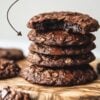 A stack of fudgy oatmeal cookies filled with melted chocolate, showcasing a bite revealing the soft, decadent center.