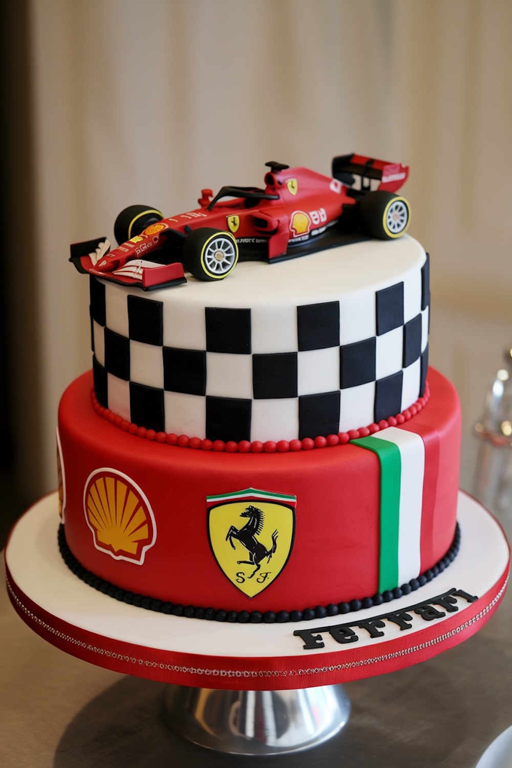 A sleek Aston Martin Formula 1 cake with a luxurious two-tier design. The top tier features quilted silver fondant with teal accents, topped with a detailed Aston Martin F1 car, capturing the elegance and speed of the iconic brand.
