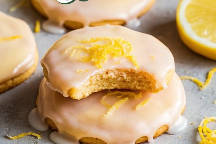 Close-up of lemon meltaway cookies topped with glaze and fresh lemon zest, showcasing their soft, citrusy texture.