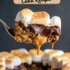 Spoonful of peanut butter s'mores cake with melted chocolate and caramel oozing from between layers of crumbly cake and fluffy marshmallow, with text overlay 'PEANUT BUTTER S'MORES Cake Recipe'.