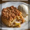 A slice of classic pear dump cake with vanilla ice cream on a vintage-style plate, with a text overlay that reads 'Classic Pear Dump Cake' and 'Perfect with Vanilla Ice Cream.'