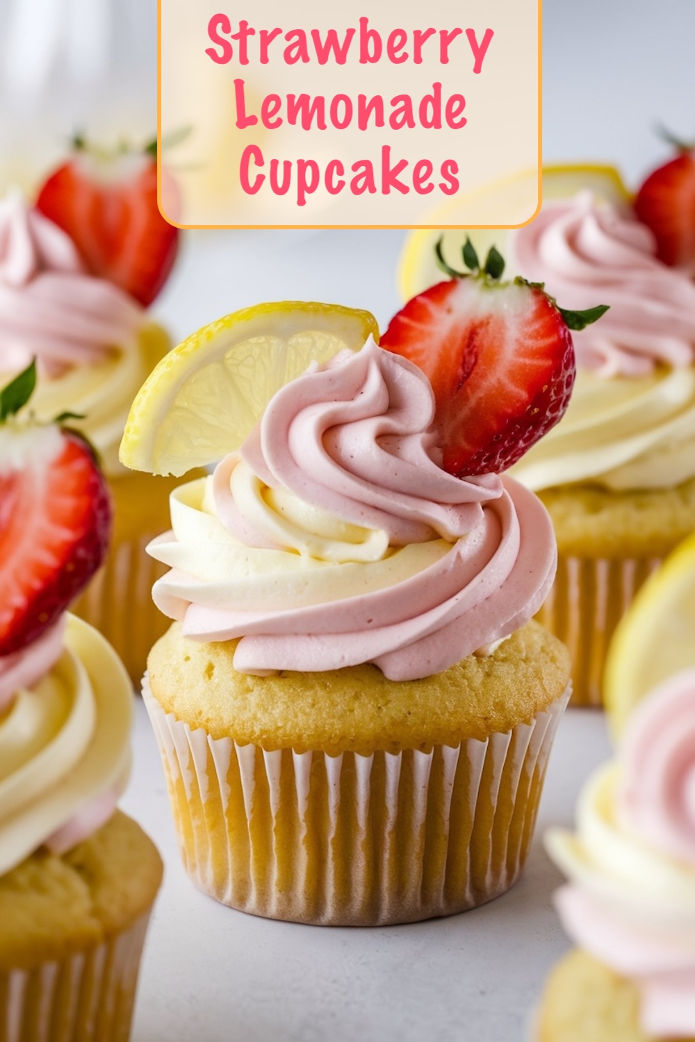 Bright and vivid image showing Strawberry Lemonade Cupcakes topped with dual-tone pink and yellow swirled frosting, garnished with fresh strawberry slices and a lemon slice, set against a light backdrop.