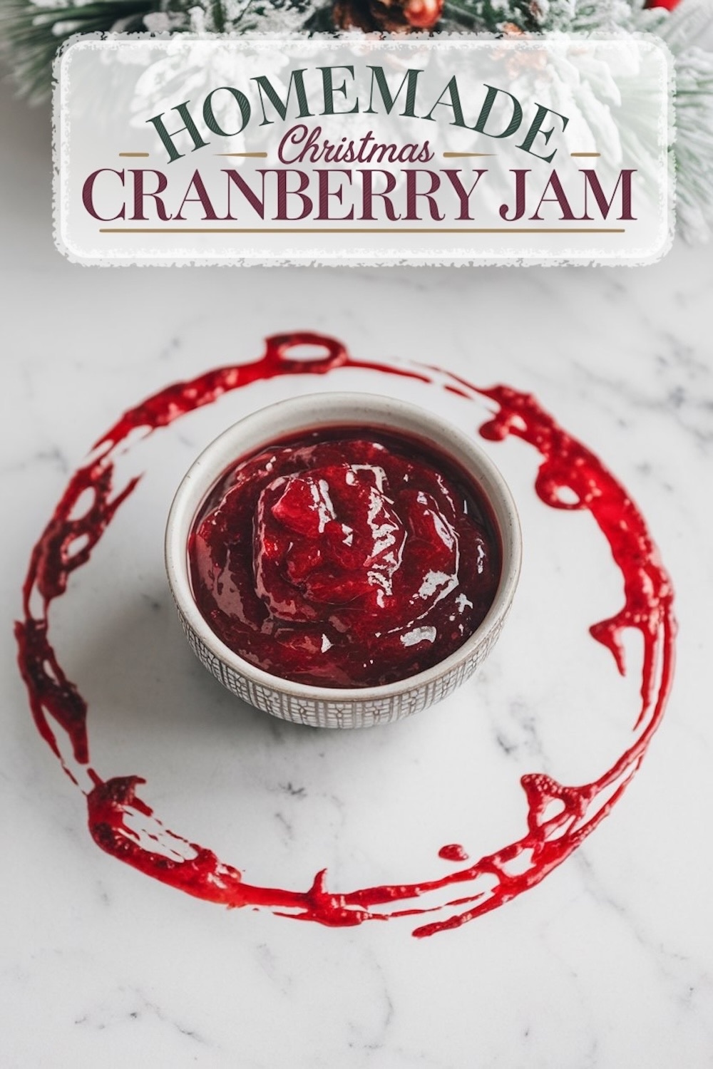A festive presentation of "Homemade Christmas Cranberry Jam" with a rustic, frosted holiday background. The jam is showcased in a bowl with a decorative cranberry ring around it, emphasizing the rich, deep red color and smooth texture of the jam, perfect for seasonal celebrations.