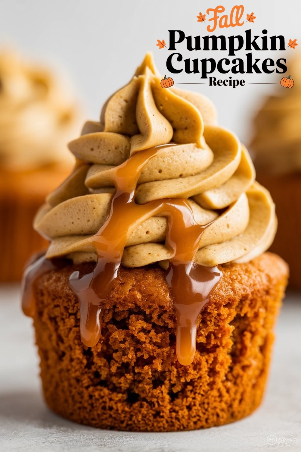 Close-up of a pumpkin cupcake topped with peanut butter frosting and caramel drizzle, featured in the 'Fall Pumpkin Cupcakes Recipe'.