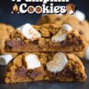 Close-up of a pumpkin s'mores cookie split in half, revealing gooey marshmallow, rich chocolate chunks, and soft pumpkin-flavored cookie dough.