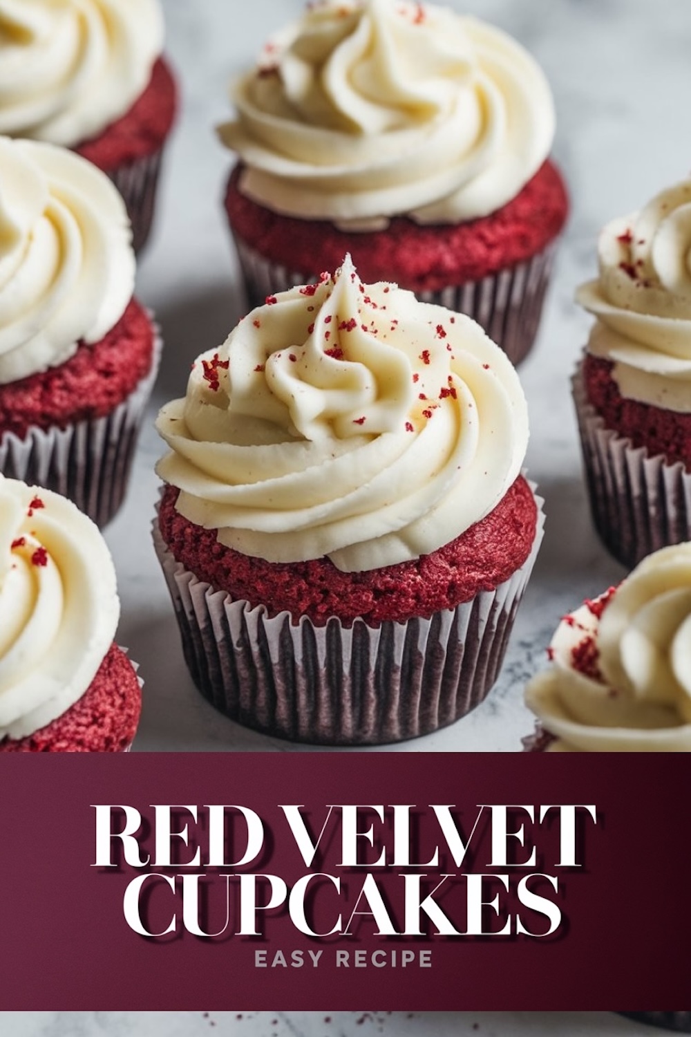 Red velvet cupcakes topped with creamy frosting and red sprinkles arranged in a group.
