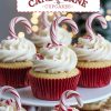 Tiered stand displaying Candy Cane Cupcakes topped with peppermint frosting, crushed candy canes, and mini candy cane sticks. A festive dessert setup perfect for Christmas parties and winter gatherings.