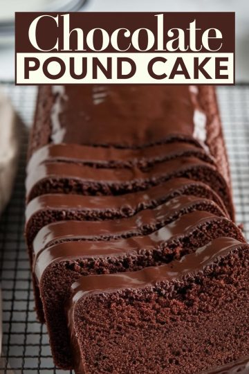 A chocolate pound cake sliced neatly on a cooling rack, each piece coated in a smooth layer of chocolate ganache. The rich chocolate color and moist crumb of the cake make it a visually stunning and irresistible choice for any chocolate dessert collection.