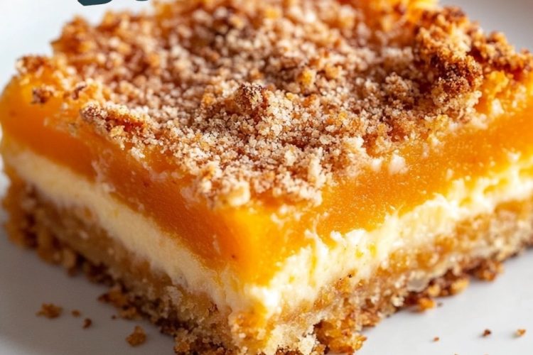 A single slice of papaya dump cake on a white plate with a focus on its crisp golden crust, creamy white filling, and sweet orange papaya center. Text overlay reads "Papaya Dump Cake."