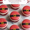 Overhead view of Santa belt macarons with even spacing, emphasizing the holiday theme. Each macaron has a bold red color, black fondant belt, and bright yellow buckle, surrounding white cream filling for a cheerful holiday look.