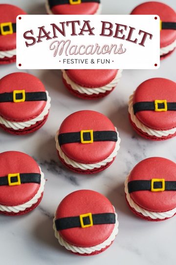 Overhead view of Santa belt macarons with even spacing, emphasizing the holiday theme. Each macaron has a bold red color, black fondant belt, and bright yellow buckle, surrounding white cream filling for a cheerful holiday look.