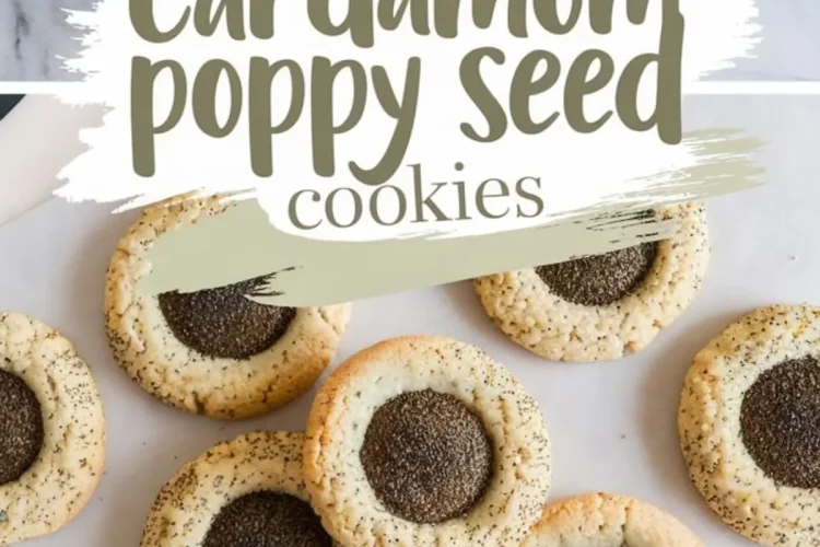 A top-down view of freshly baked cardamom poppy seed cookies arranged on a marble surface. The cookies have a golden-brown edge with a dark poppy seed center. A text overlay reads “cardamom poppy seed cookies.”
