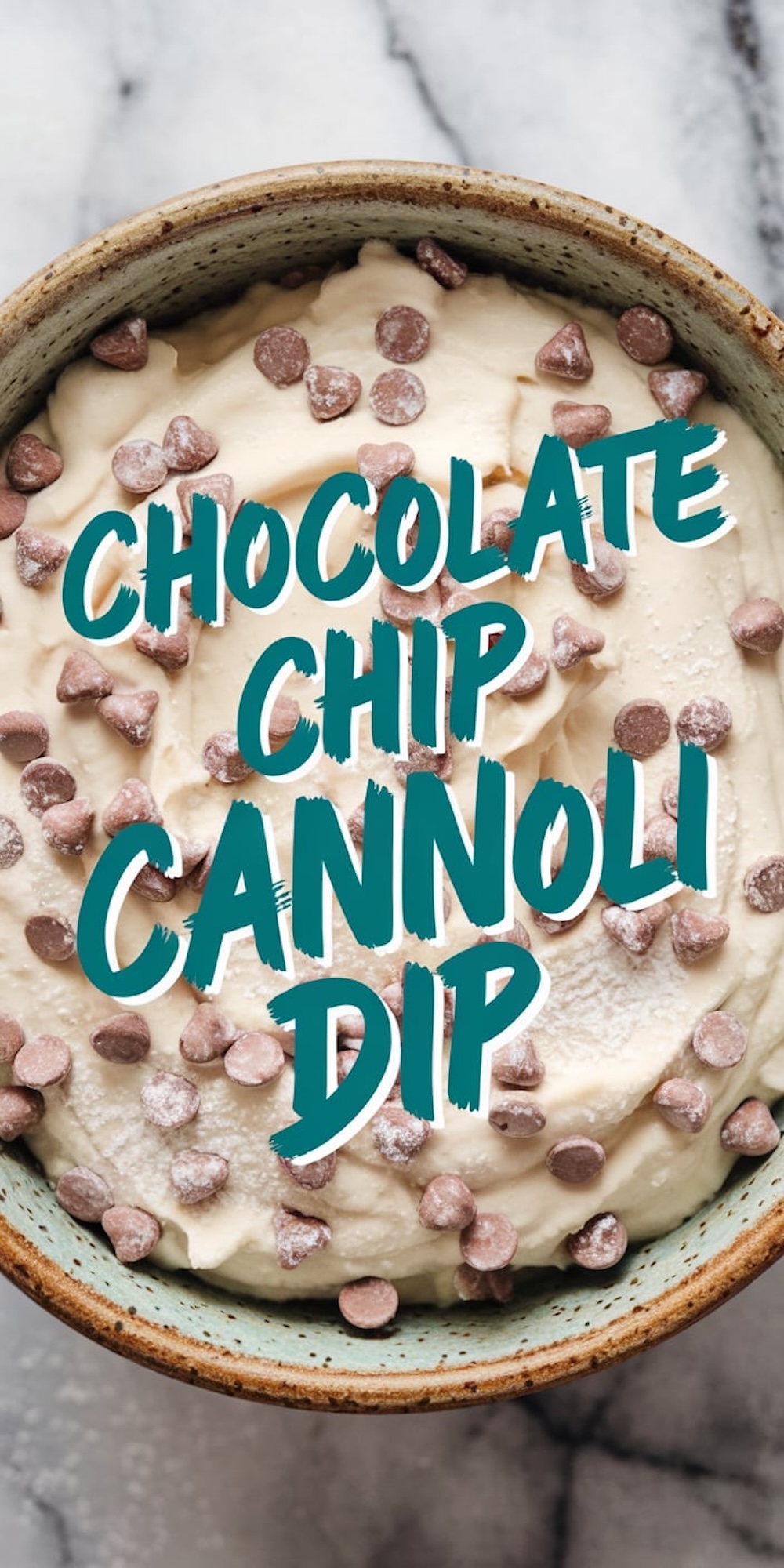 A top-down view of the same chocolate chip cannoli dip in a rustic bowl. The surface is studded with chocolate chips and lightly dusted with powdered sugar. The vibrant teal text overlay enhances its visual appeal.