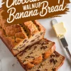 A freshly baked chocolate chip walnut banana bread loaf, partially sliced, revealing a soft texture with chocolate chips and walnuts. A butter knife with butter sits beside the loaf. Bold text overlay reads “Chocolate Chip Walnut Banana Bread.”