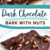 Close-up of broken pieces of dark chocolate bark on a white plate. The bark is rich and glossy, embedded with whole nuts for added texture and crunch.