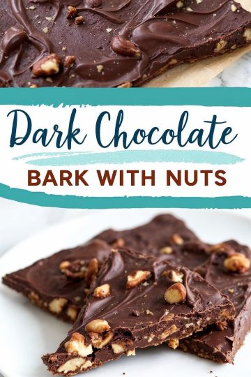 Close-up of broken pieces of dark chocolate bark on a white plate. The bark is rich and glossy, embedded with whole nuts for added texture and crunch.
