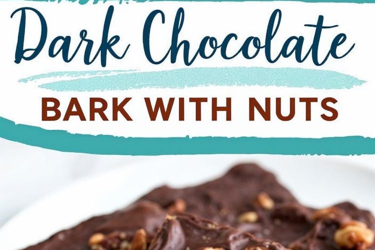 Close-up of broken pieces of dark chocolate bark on a white plate. The bark is rich and glossy, embedded with whole nuts for added texture and crunch.