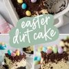 A rectangular dessert dish with a creamy Easter dirt cake. The cake is topped with a layer of crushed chocolate cookies, colorful candy eggs in pastel shades, and chocolate shavings. A section of the cake is cut out, revealing its rich chocolate crust and fluffy cream layers.