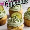 Front view of multiple pickle cupcakes, each decorated with creamy dill frosting, a pickle slice, and a sprig of dill. The vibrant green frosting stands out against the golden cupcake base. Text overlay says, “Pickle Cupcakes.”
