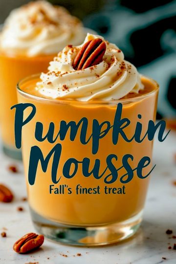 Overhead shot of two servings of pumpkin mousse. One cup is topped with whipped cream and a pecan, while the other showcases the mousse’s creamy swirls. Scattered pecans and cinnamon powder add a rustic, autumn-inspired touch. Text overlay reads “Pumpkin Mousse.”