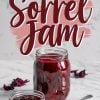 A large mason jar filled with vibrant red homemade sorrel jam placed on a white marble surface. A smaller bowl filled with the same jam sits beside it, along with a silver spoon. Dried sorrel petals are scattered decoratively in the background. Text overlay reads “Homemade Sorrel Jam” in bold, elegant script.