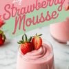 A single serving of light and fluffy strawberry mousse in a clear glass, garnished with a fresh whole strawberry and a strawberry half. The pink dessert is styled with vibrant text reading “Light & Fluffy Strawberry Mousse” on a pastel background.