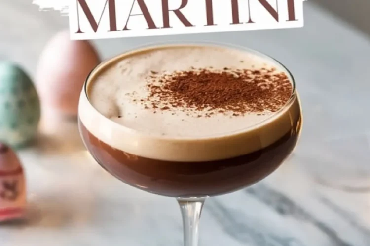 Easter Espresso Martini in a coupe glass on a marble countertop, garnished with cocoa powder. The background includes pastel Easter eggs and themed text reading “Easter Espresso Martini.”