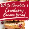 A sliced white chocolate cranberry banana bread loaf with three stacked pieces. The bread has a soft texture with cranberries and melted white chocolate visible. A red banner with the text “White Chocolate & Cranberry Banana Bread” overlays the image.
