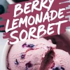 Close-up of berry lemonade sorbet scoops in a white bowl, with a bold magenta text overlay that reads “Berry Lemonade Sorbet,” highlighting the creamy texture and visible whole berries in the frozen dessert.