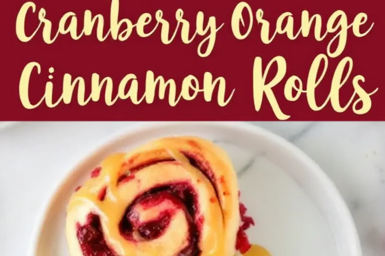 Cranberry orange cinnamon rolls served on white plates, drizzled with caramel glaze. The rolls have a vibrant red cranberry filling swirled in soft dough. A red banner with white text reads “Easy Cranberry Orange Cinnamon Rolls.”