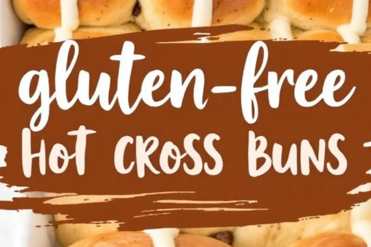 A baking dish filled with soft, gluten-free hot cross buns with raisins and a glossy surface. White icing crosses decorate the top, and a rustic text overlay emphasizes the gluten-free recipe.