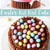 A chocolate Easter Kit Kat cake with a glossy chocolate surface, pastel candy eggs, and Kit Kat bars forming a border. A pink ribbon is tied around the cake. A text overlay says “Easter Kit Kat Cake” in a playful font with pastel accents.