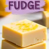 Two thick squares of creamy lemon fudge stacked on marble, topped with bright lemon zest, with a bold purple “LEMON FUDGE” text overlay above them on a lilac paint stroke background.