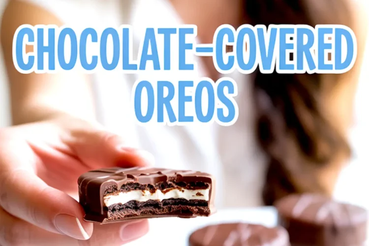 Smiling Emma in the background holds up a halved chocolate-covered Oreo, revealing cream filling between cookie layers, with more dipped Oreos placed on a plate and “Chocolate-Covered Oreos” in blue text overlay.