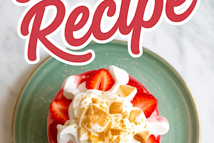 Top view of a glass filled with Eton Mess, decorated with whipped cream, halved strawberries, and golden meringue crumbles, set on a green plate with “Eton Mess Recipe” text overlay.