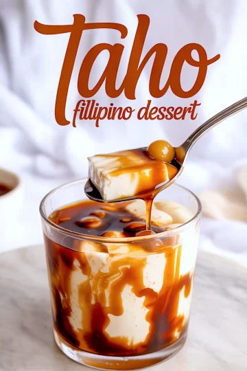 Glass of taho with spoon lifting a piece of tofu topped with arnibal syrup and tapioca pearls, text overlay reads “Taho Filipino Dessert” against a soft fabric backdrop.