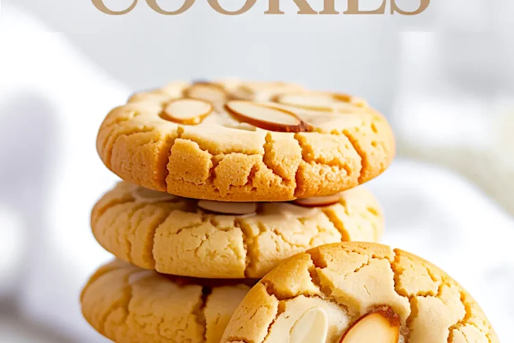 Stack of golden almond cookies with crackled tops and sliced almonds, with one cookie leaning against the stack, and text overlay reading “Best Almond Cookies” for recipe highlight.