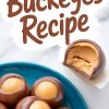 Buckeye candies on a blue plate, with one candy bitten open showing smooth peanut butter filling, topped with large “Buckeyes Recipe” text on a white background.
