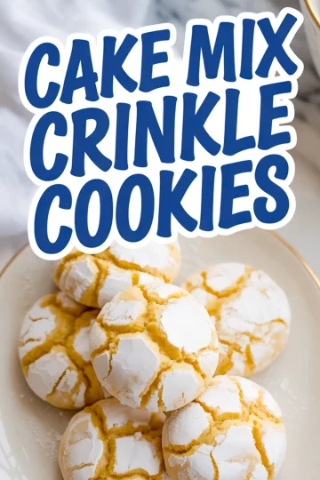 Top view of a white bowl filled with powdered sugar-dusted yellow crinkle cookies with bold text overlay reading “Cake Mix Crinkle Cookies.”