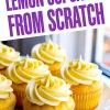 Decorative image with multiple lemon cupcakes topped with swirls of lemon frosting on a white plate by the window, overlaid with the text “Lemon Cupcakes From Scratch” in bold purple font.