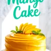 Glossy mango cake topped with fresh mango slices and mint leaves on a marble cake stand, with bold turquoise “Mango Cake” text in the background.