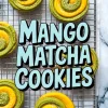Swirled mango matcha cookies on a wire rack with vibrant green and yellow coloring, decorated with sugar crystals and overlaid text reading "Mango Matcha Cookies" in bold pastel lettering.