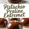 Glossy chocolate dome-shaped pistachio praline entremets topped with chopped pistachios, displayed on a marble surface with a crisp base layer.