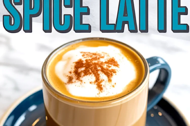 A glass mug of pumpkin spice latte topped with whipped cream and cinnamon, placed on a blue saucer with bold blue text reading “Pumpkin Spice Latte” above the mug.