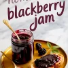 Homemade blackberry jam in a glass jar with a gold spoon, served on a golden plate with a slice of bread topped with jam and fresh blackberries, styled with handwritten “homemade blackberry jam” text overlay.