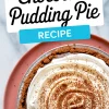 Overhead shot of a chocolate pudding pie in a foil pan topped with spiraled whipped cream and cocoa dusting, presented on a pink plate with a “Chocolate Pudding Pie Recipe” title.