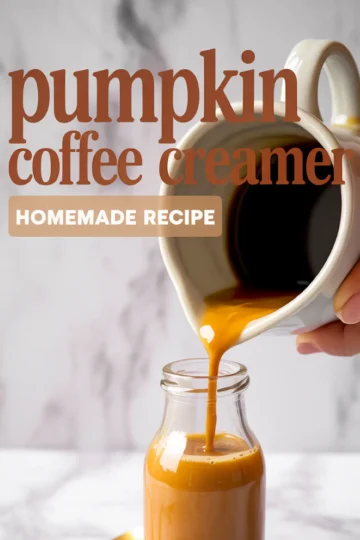 Homemade pumpkin coffee creamer being poured from a pitcher into a glass bottle, with text overlay reading “Pumpkin Coffee Creamer Homemade Recipe.”