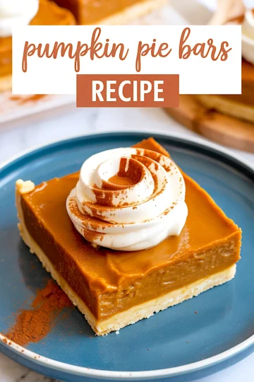 Close-up of a pumpkin pie bar slice with a swirl of whipped cream and cinnamon on a blue plate, emphasizing the creamy pumpkin layer and golden crust.