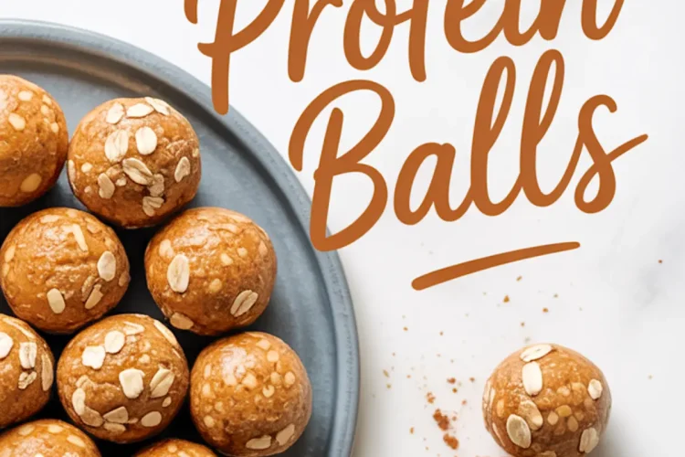 Flat lay Pinterest image with pumpkin protein balls topped with oats on a blue plate and two balls in the foreground, one bitten to reveal a soft center, with “Pumpkin Protein Balls” written in bold script across a white marble background.