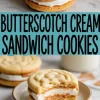 Butterscotch cream sandwich cookies with swirled vanilla cookies, filled with a thick layer of marshmallow fluff and butterscotch spread, served on a plate with a clean bite showing the soft interior.